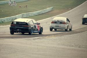 One of the ICY Saturns, Joe Nonnamaker / Bill Pate VW Corrado and Dan Hiner / Mark Scharnow Honda CRX Si