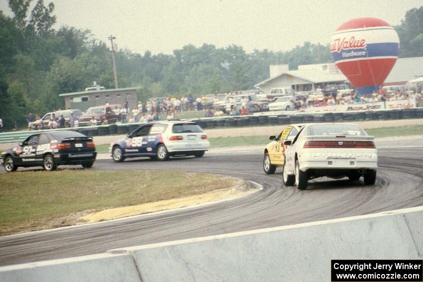 Four cars come through corner five