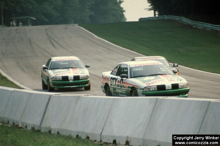 Paul Hacker / Karl Hacker and Chuck Hemmingson / Buddy Norton Olds Achieva SCXs with one of the Dodge Stealths splitting them