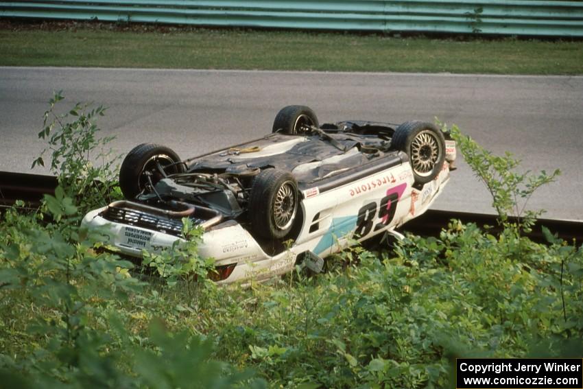 Peter Argetsinger's Toyota MR-2 Turbo jumped the outside turn 12 guardrail on lap 4 before landing upside down