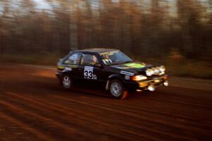 Tom Ottey / Pam McGarvey Mazda 323GTX at speed on the practice stage.