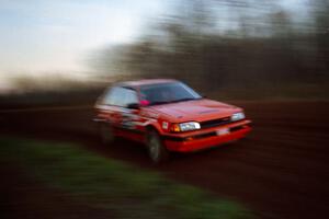 Gail Truess / Pattie Hughes Mazda 323GTX at speed on the practice stage.