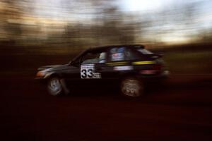 Tom Ottey / Pam McGarvey Mazda 323GTX at speed on the practice stage.