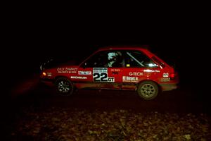 Gail Truess / Pattie Hughes Mazda 323GTX comes into the flying finish of SS10, Fuller Lake.