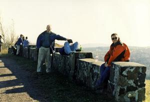 Bill Taylor (holding hat), Randy Jokela (napping) and Brad Folino on the wall at the yump on Brockway Mountain.