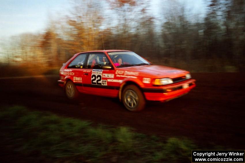 Gail Truess / Pattie Hughes Mazda 323GTX at speed on the practice stage.