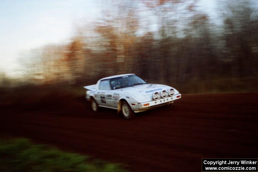 Ted Grzelak / Chris Plante Mazda RX-7 at speed on the practice stage.