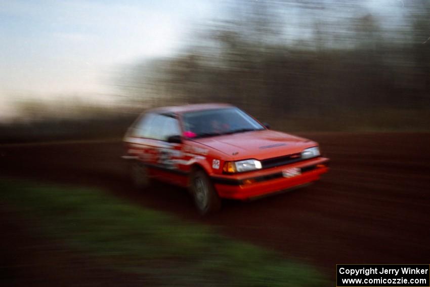 Gail Truess / Pattie Hughes Mazda 323GTX at speed on the practice stage.