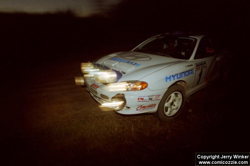 Paul Choiniere / Jeff Becker Hyundai Tiburon at a 90-left on SS3, Far Point I.