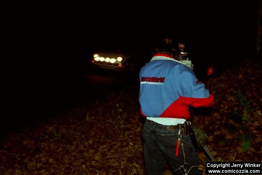 Mike Hurst / Rob Bohn Mazda RX-7 passes in front of ESPN2 cameraman Glenn Mazzone at the flying finish of SS10, Fuller Lake.