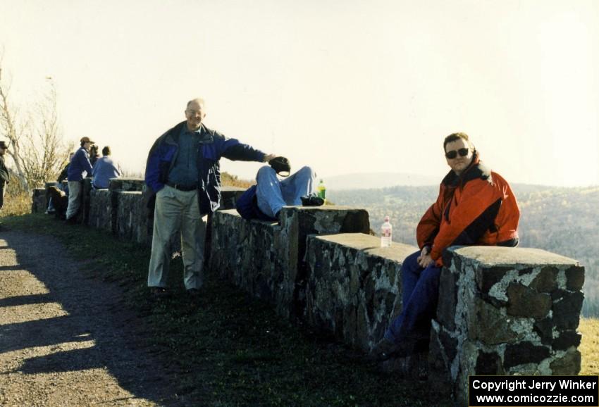 Bill Taylor (holding hat), Randy Jokela (napping) and Brad Folino on the wall at the yump on Brockway Mountain.