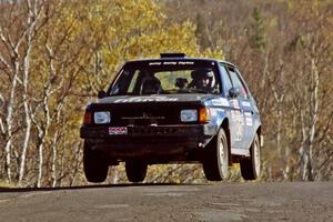 Mark Utecht / Brenda Corneliusen Dodge Omni GLH-Turbo catches some air at the final yump on SS13, Brockway I.