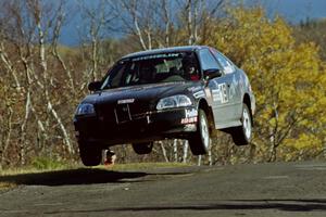 Jay Kowalik / Mike Dunn Honda Civic CVT catches nice air at the final yump on SS13, Brockway I.