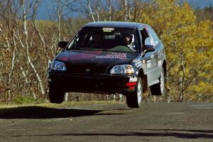Bryan Hourt / Pete Cardimen Honda Civic catches nice air at the final yump on SS13, Brockway I.