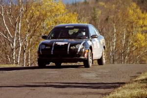 Evan Moen / Ron Moen Plymouth Neon at speed on SS13, Brockway I.