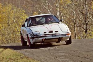 Craig Kazmierczak / Diane Sargent Mazda RX-7 at speed on SS13, Brockway I.