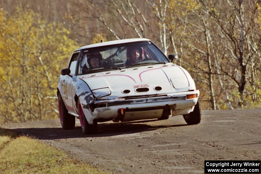 Craig Kazmierczak / Diane Sargent Mazda RX-7 at speed on SS13, Brockway I.