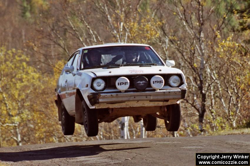 Jeremy Butts / Peter Jacobs Plymouth Arrow catches nice air at the final yump on SS13, Brockway I.