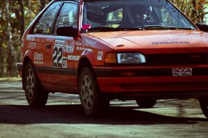 Gail Truess / Pattie Hughes Mazda 323GTX at speed on SS14, Brockway II.