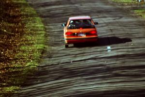 Gail Truess / Pattie Hughes Mazda 323GTX at speed on SS14, Brockway II.