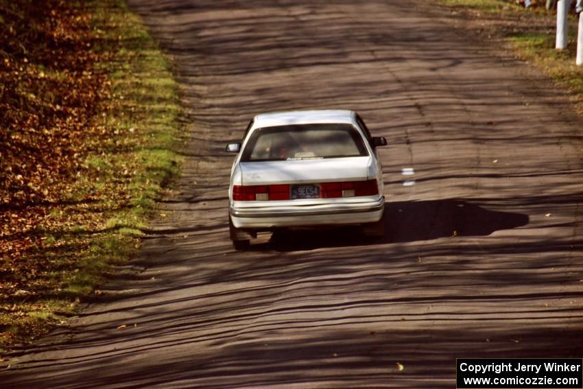 Henry Krolikowski / Cindy Krolikowski Dodge Shadow at speed on SS14, Brockway II.