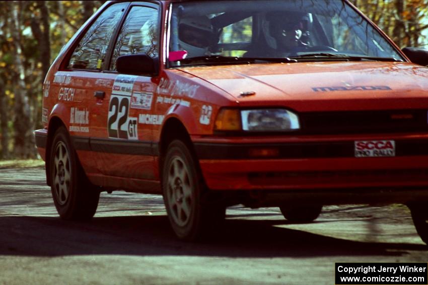 Gail Truess / Pattie Hughes Mazda 323GTX at speed on SS14, Brockway II.