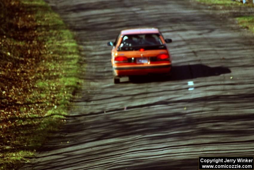 Gail Truess / Pattie Hughes Mazda 323GTX at speed on SS14, Brockway II.