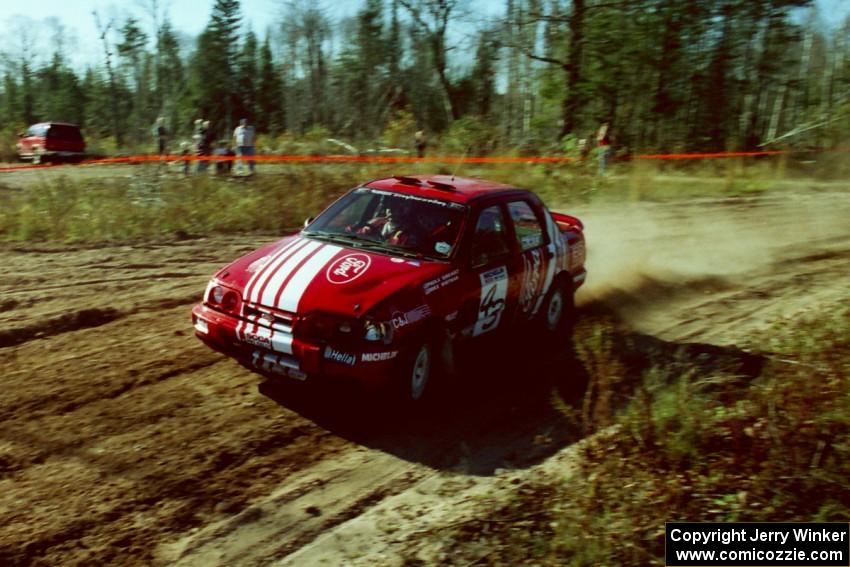 Mike Whitman / Paula Gibeault Ford Sierra Cosworth at speed through the spectator corner of SS15, Gratiot Lake II.