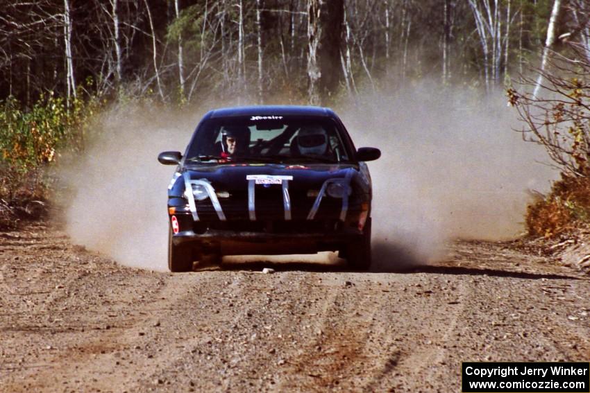 Evan Moen / Ron Moen Plymouth Neon at speed near the finish of SS15, Gratiot Lake II.