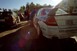 Tom Ottey / Pam McGarvey Mazda 323GTX and Garen Shrader / Doc Schrader Mitsubishi Lancer Evo IV await tech.