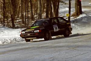 Tom Ottey / Pam McGarvey Mazda 323GTX sets up for a 90-left at the SS1 spectator corner.