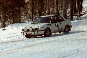 Henry Krolikowski / Cindy Krolikowski set up their Dodge Shadow for a 90-left at the SS1 spectator corner.