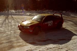 Tom Lawless / Sean Devine drift through a 90-left in their Eagle Talon at the SS1 spectator corner.