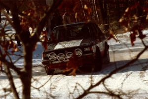 Eric Schroeder / Jeff Secor VW Jetta drifts wide at a slippery left-hander at the SS1 spectator location.