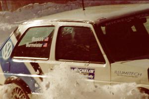 Eric Burmeister / Mark Buskirk VW GTI tags the outside bank at the SS1 spectator point.