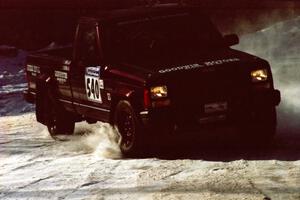 Scott Carlborn / Dale Dewald slide their Jeep Comanche wide at the SS1 spectator location.