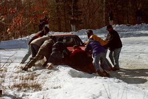 Brian Vinson / Richard Beels VW GTI gets pushed back out of the bank at the spectator corner on SS1.