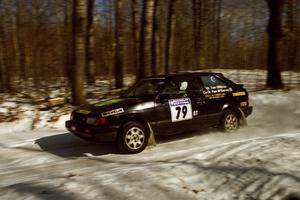 Tom Ottey / Pam McGarvey Mazda 323GTX at speed on SS3.