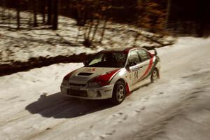 Garen Shrader / Doc Schrader limp through SS3 at speed with a flat right-rear on their Mitsubishi Lancer Evo IV.