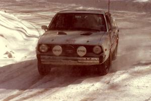 Jeremy Butts / Peter Jacobs Plymouth Arrow drives through snow dust at a right-hander on SS3.