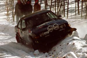 Lynn Dillon / J.B. Lewis encountered slippery conditions on SS3 and perched their Pontiac Sunbird on a snowbank.