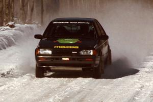 Tom Ottey / Pam McGarvey Mazda 323GTX comes into the flying finish of the stage before the first service.