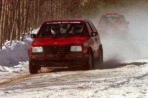 Brian Vinson / Richard Beels VW GTI presses on with a flat left-front on the stage prior to the lunch break.