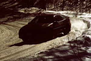 Celsus Donnelly / Brendan Lawless drift their Eagle Talon through a slippery downhill right-hander on the stage.