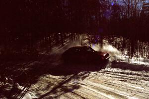 Jon Butts / Gary Butts drift wide and clip the outside bank in their Dodge Omni.