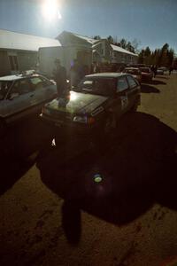 Tom Ottey / Pam McGarvey Mazda 323GTX prepares to go back out onto the stages after the midday break.