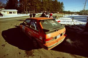 Gail Truess / Pattie Hughes prepare to go back out to the stages in their Mazda 323GTX.