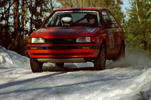 Gail Truess / Pattie Hughes at speed in their Mazda 323GTX before sundown.