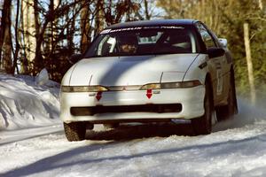 Chris Czyzio / Eric Carlson Mitsubishi Eclipse at speed over a crest before sundown.