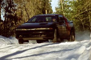 Cal Landau / Eric Marcus kick the tail out on their Mitsubishi Eclipse GSX over a blind crest before sundown.